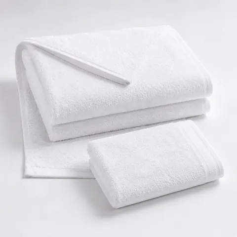 Folded white hospital towels