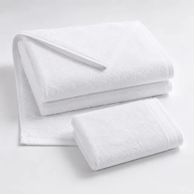 Folded white bath towel and hand towel