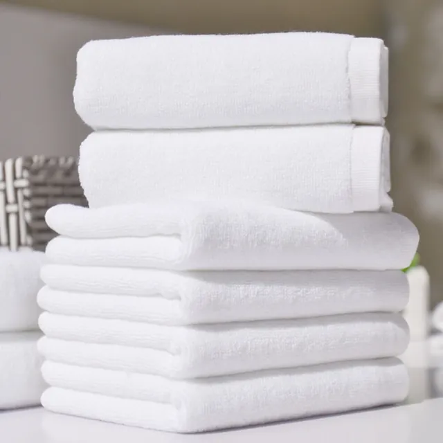 Stack of white hospital towels