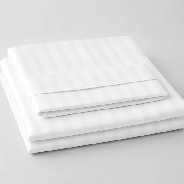 Folded white hospital bedsheets